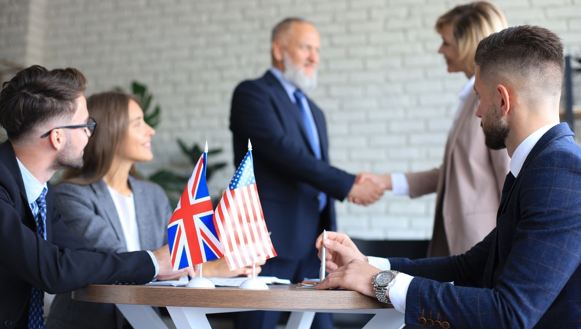 United Kingdom and American leaders shaking hands on a deal agreement Employment laws in UK